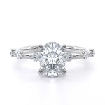 Rua Oval engagement ring with oval cut diamond and round diamonds on silver band