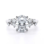 Winter Oval engagement ring with oval diamond center and scattered round diamond shoulder design