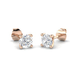 Round Brilliant Cut Diamond stud earrings in 18kt rose gold with F/G color and SI1 clarity