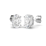 Oval cut diamond stud earrings in white gold with F/G color and SI clarity