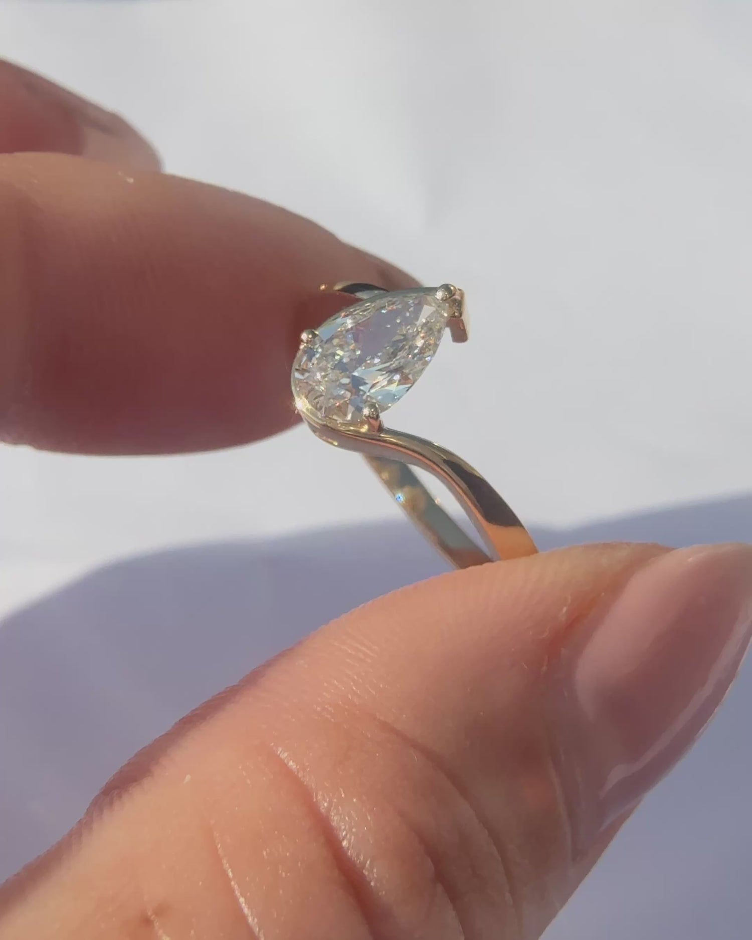 Pearshape Diamond Twist Solitaire Ring