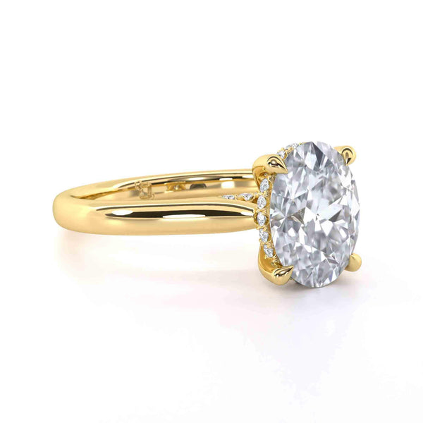 Bridget Oval engagement ring with oval cut diamond and gold band showcasing diamond bridge and gallery design