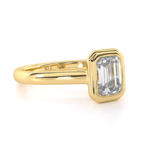 Betty Emerald Cut diamond bezel set engagement ring with sleek modern design