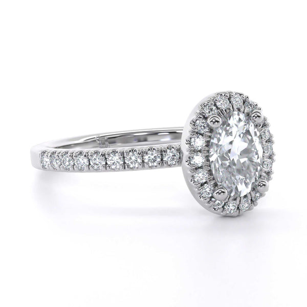 Sophia Oval engagement ring with oval cut diamond and micro set diamond halo on a diamond-studded band