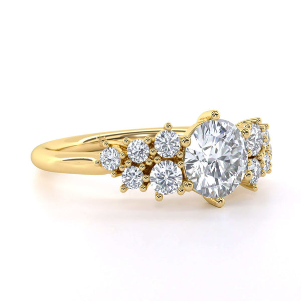Winter Round brilliant cut diamond engagement ring with scattered diamond shoulders and elegant design