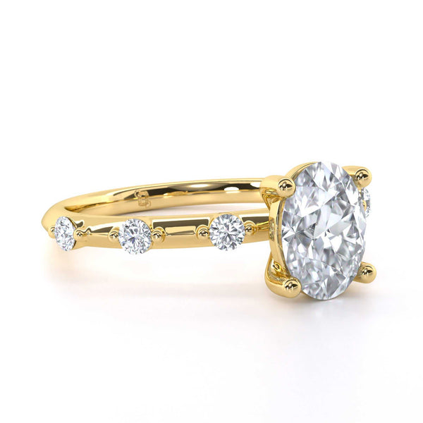 Rua Oval engagement ring with oval cut diamond and round diamonds on gold band