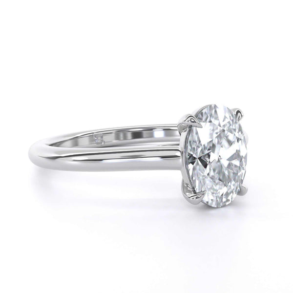 Billie Oval engagement ring with oval cut diamond solitaire and bridge setting in white gold