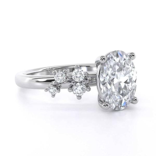 Winter Oval engagement ring with oval diamond and scattered round diamond shoulder in silver setting