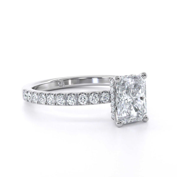 Piper Radiant diamond ring with radiant cut center stone and diamond halo on a white gold band