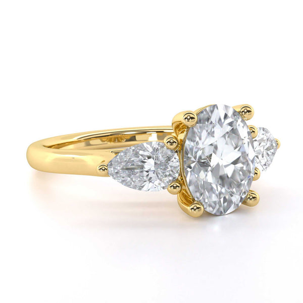 Kathryn Oval cut diamond trilogy engagement ring with pear-shaped side stones and elegant design