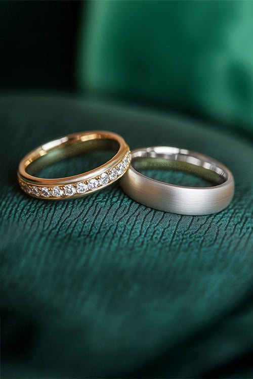 Diamond wedding rings by Clarity Diamonds by Aimee on green leather background