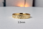 Floral engraved rose diamond band