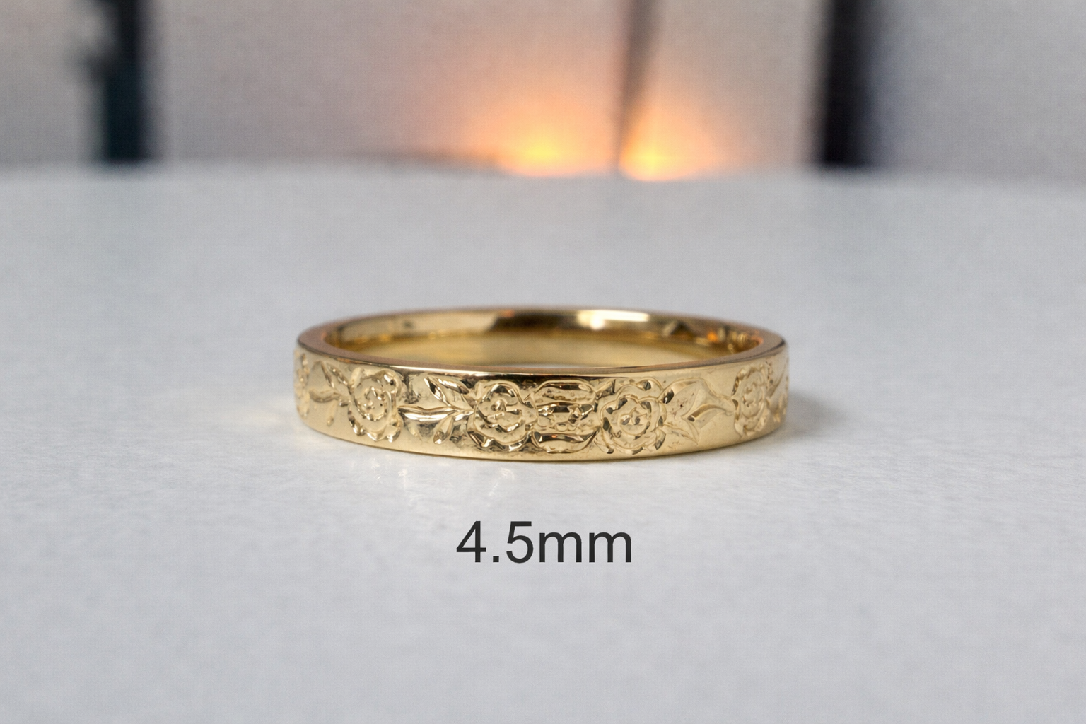 Floral engraved rose diamond band