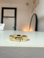 Floral engraved wedding band