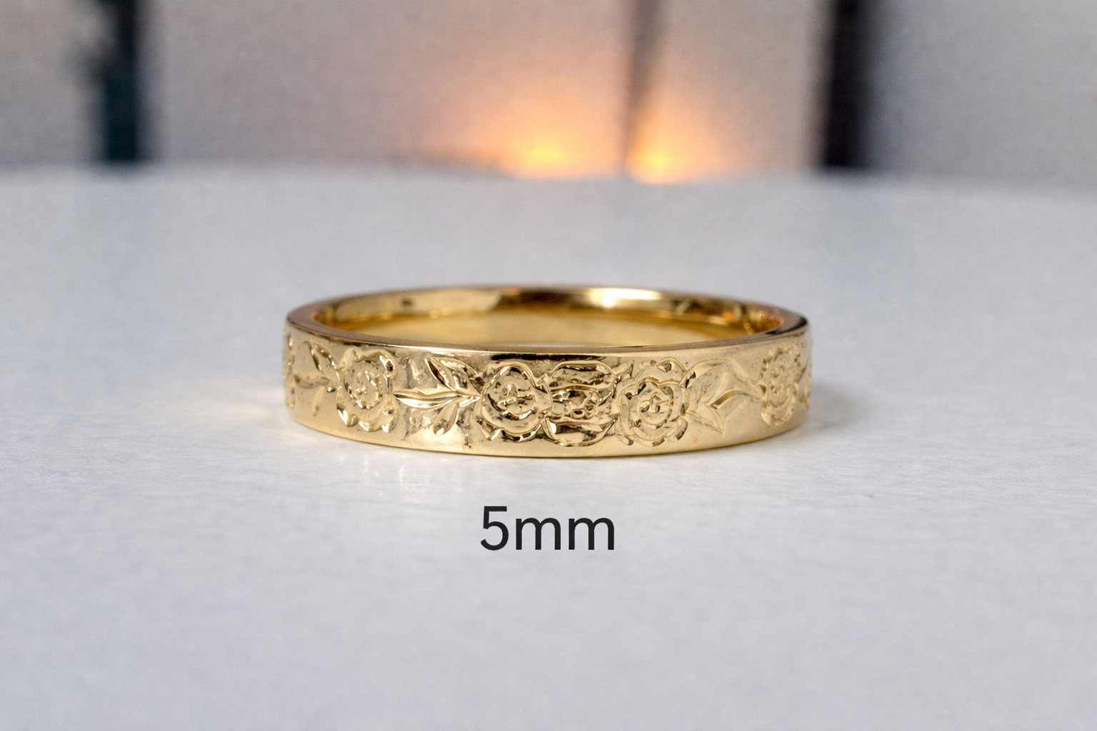 Floral engraved rose diamond band