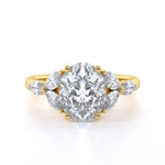 Oval diamond engagement ring with marquise shoulders