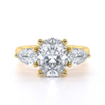 Oval and pear shape trilogy diamond engagement ring