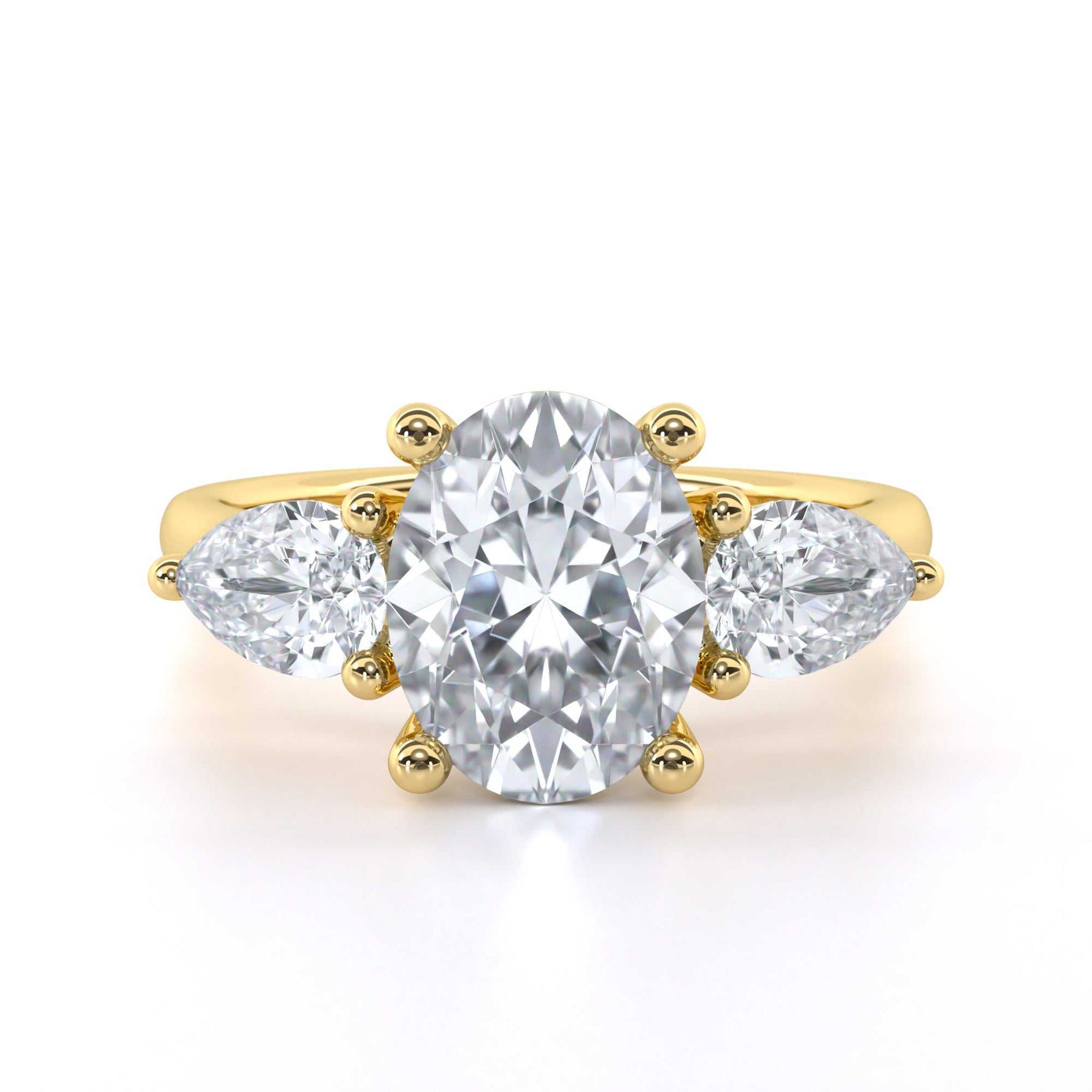 Oval and pear shape trilogy diamond engagement ring