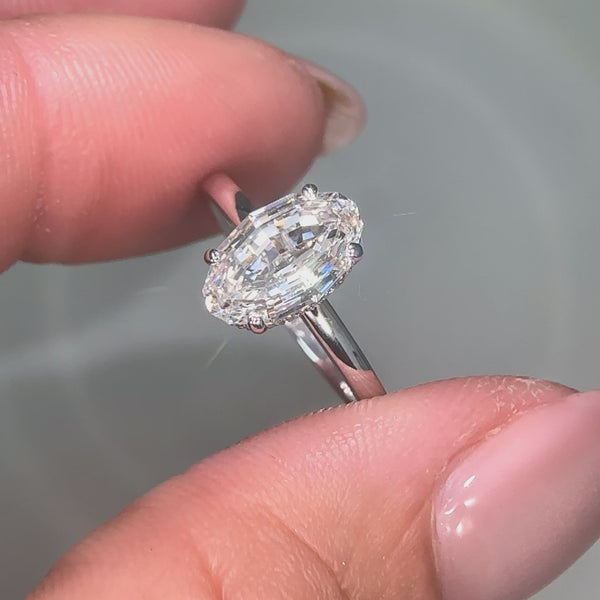 Lab grown step cut oval diamond ring