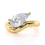 Pear shape diamond curved band engagement ring