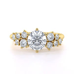 Round brilliant diamond shoulder engagement ring