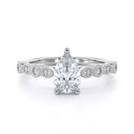 Vintage pear shape diamond engagement ring
